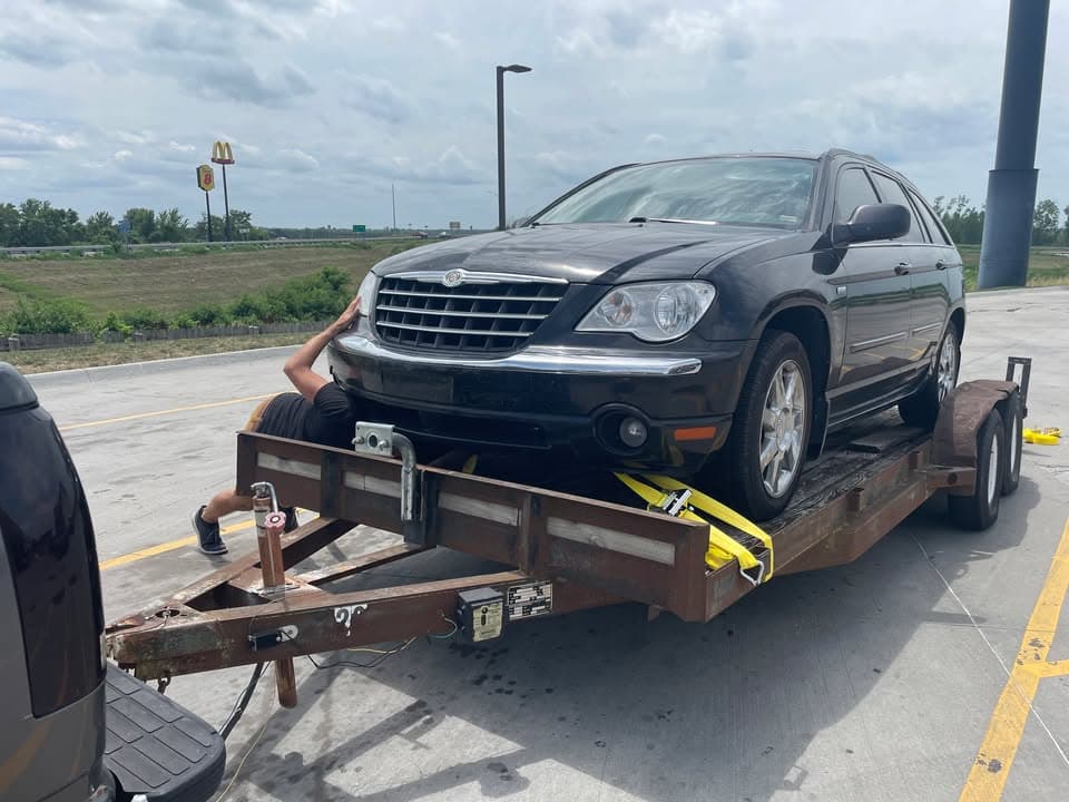Car on flatbed hauler
