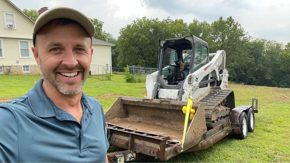 Jared with Bobcat on trailer